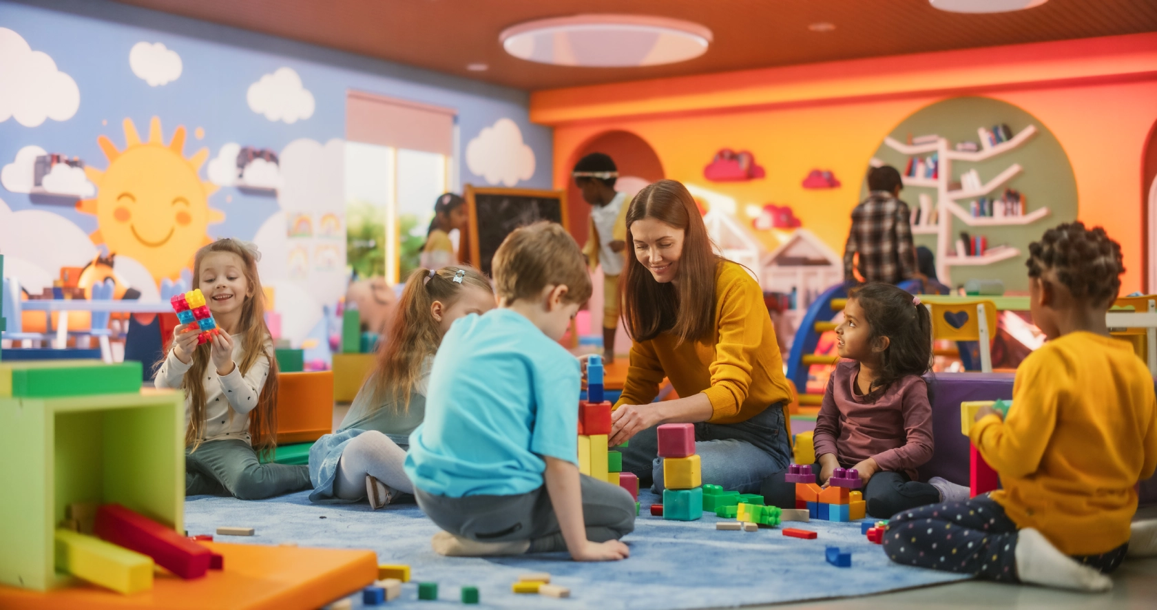 Children and teacher playing with colorful blocks.