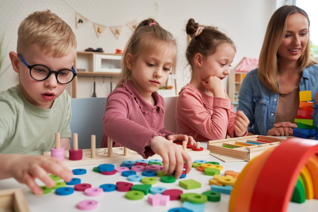 GettyImages-2201772644 (1) (7) Children playing with colorful educational toys.